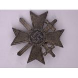 A German Third Reich War Merit Cross, first class, with swords