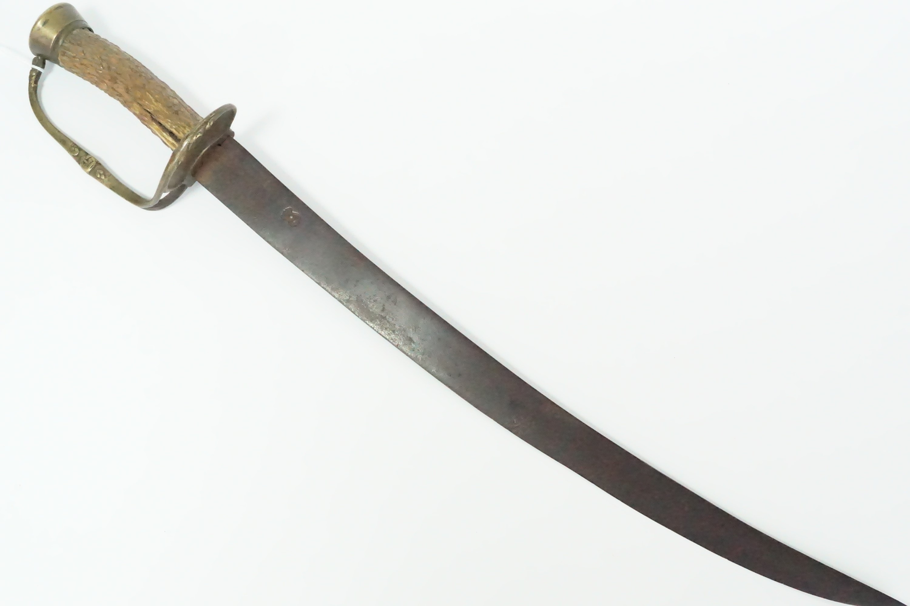 A late 17th Century hunting hanger, the curved tapering blade bearing a struck cutler's mark in