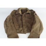 A 1940 Pattern Battledress Blouse bearing 7th Armoured Division Royal Signals insignia