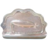 A 1930s copper plaque bearing a relief depiction of the airship R101, 9 cm x 15 cm