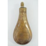 A Victorian Hawksley copper and brass powder flask, the bag shaped body relief-decorated in a