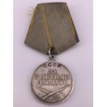 A Soviet Medal for Combat Service, numbered 1622399