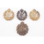 A group of Royal Flying Corps cap badges