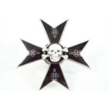 An Imperial Russian 5th Hussars enamelled breast / cap badge, comprising a black Maltese cross