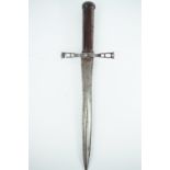 An antique dagger, having the truncated blade of a colichemarde, having a cast steel reticulated