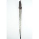 An 18th Century Scottish dirk, having a grip of traditional form, likely holly, carved overall