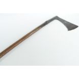 A Medieval axe, the blade bearing punched cruciform marks, the socket faceted at its terminal, the