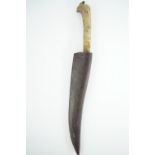 An antique Indo-Persian kard, of diminutive stature, the grip having jade scales, the blade