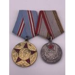 A Soviet Medal for a Veteran of Labour and the Jubilee Medal for 50 Years of the Soviet Militia