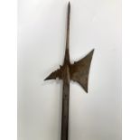 A 16th Century style halberd, the head bearing a finely engraved armorial crest and the dates 1912-