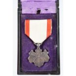 An Imperial Japanese Order of the Rising Sun medal, cased