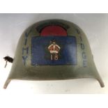 An Imperial German helmet armoured brow plate or Stirnpanzer, bearing painted Canadian commemorative