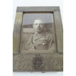 A Great War Arts and Crafts influenced electroplate photograph frame bearing an applied Royal Flying