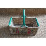 A vintage straw-worked hand basket, circa 1940s