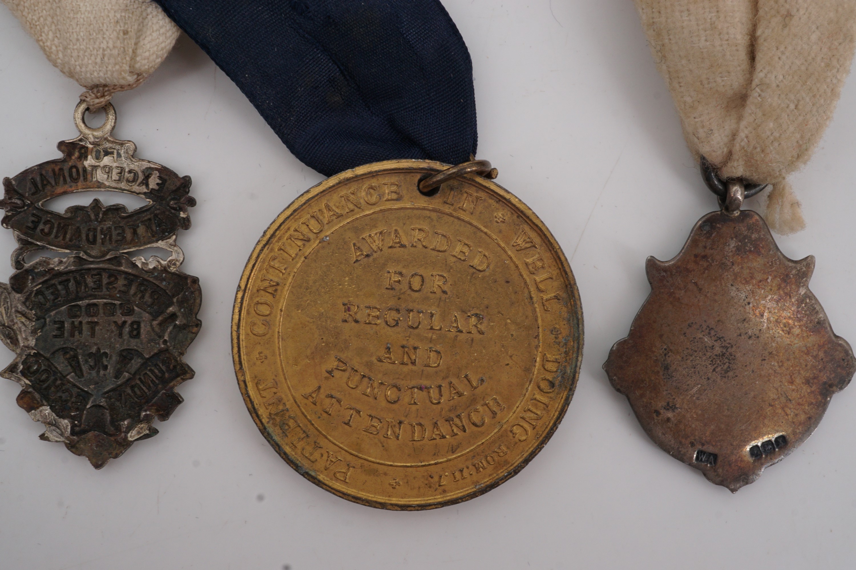 An early 20th Century silver watch chain fob medallion together with two Sunday school attendance - Image 2 of 2