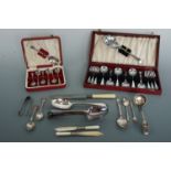 A cased dessert set, cased teaspoons and flatware