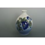 A Royal Copenhagen oviform vase decorated in depiction of blue-blossoming flowers, 17 cm