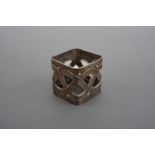 A WMF electroplate napkin ring of rounded square section and reticulated in a Celtic style