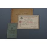 A 1926 LMS Railway medical handbook together with a certificate and enamelled fob medallion