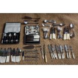 A quantity of electroplate cutlery including cased grapefruit spoons and tea knives, a cake set,