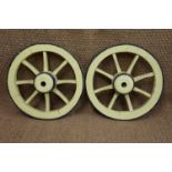A pair of antique small wooden cartwheels with iron tyres, 50 cm diameter