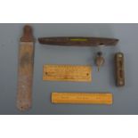 Tools and instruments including a Rabone torpedo level and one other, a brass plumb bob, a Harling