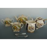 A Queen Elizabeth II coronation teapot and jug, two 1937 Coronation teaspoons and butter knife,