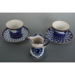 Hand-decorated Saint Petersburg Russian porcelain cups and saucers together with a jug