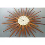 A 1960s Seth Thomas teak sunburst wall clock, 66 cm