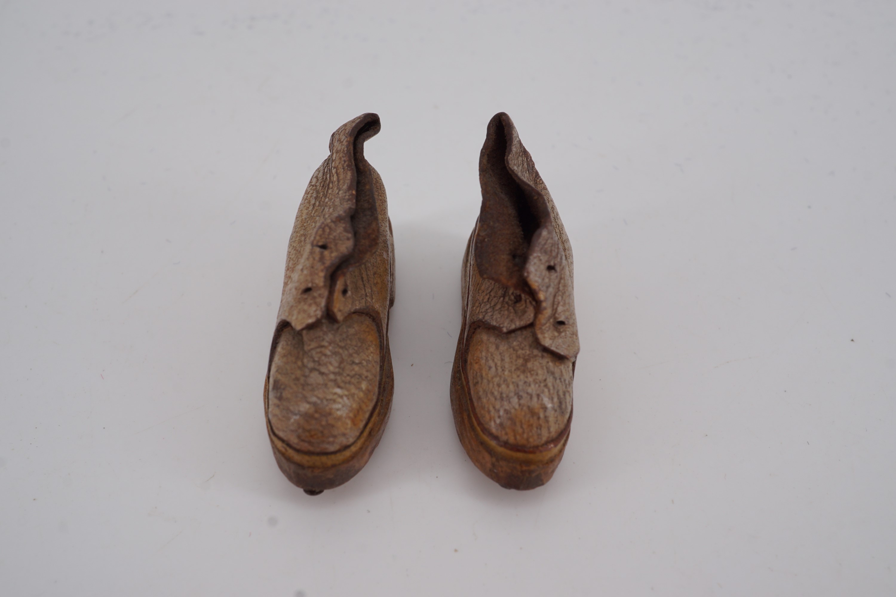 A pair of miniature clogs