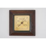A 1930s German Atco aneroid barometer, having a gilt square dial and moulded oak frame, 18 cm