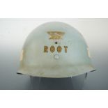 A US M1 helmet liner with insignia and provenance