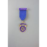 A Langholm Rotary Club past president silver-gilt medal