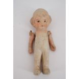A 1920s porcelain articulated doll, 9.5 cm