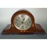 An early 20th Century marquetry-inlaid mahogany "Napoleon's hat" clock, 53 cm x 27 cm high