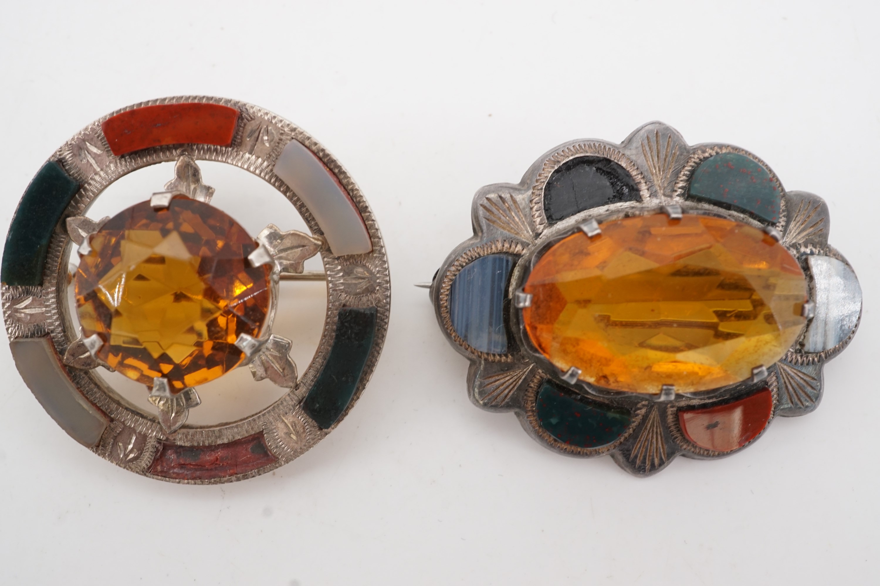 Two antique Scottish white metal and polished hard stone brooches, each centred by a facet-cut - Image 2 of 2