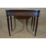 An early 19th Century ebony string-inlaid and cross-banded mahogany turn-over-top tea table,