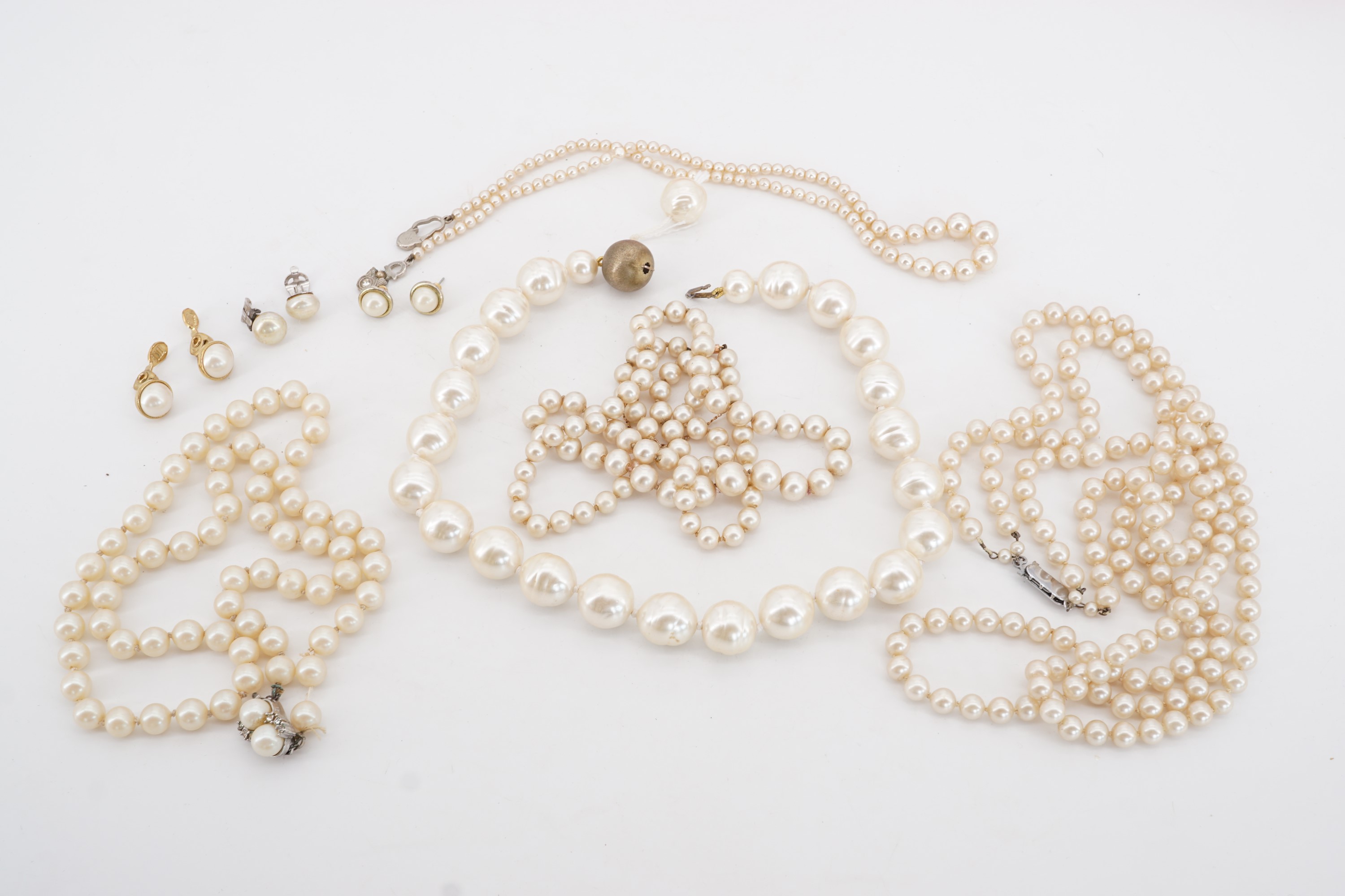 A quantity of vintage costume pearls in a Ciro box