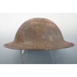 A decorated Great War Brodie helmet shell