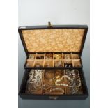 A jewellery box containing a quantity of vintage costume jewellery