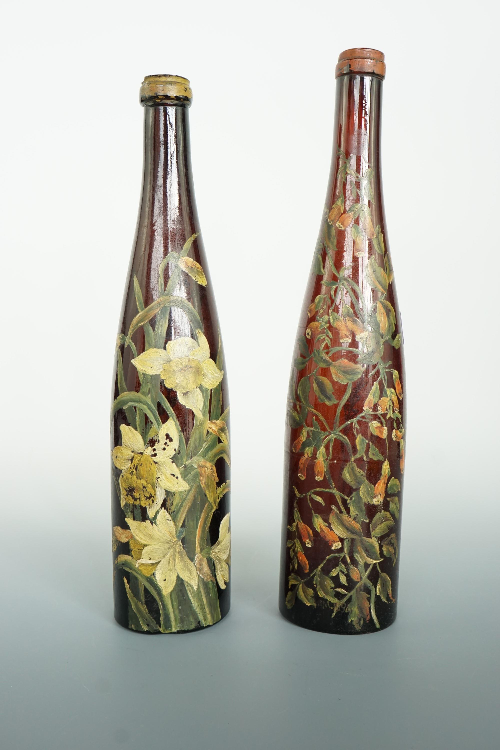 Two late 19th / early 20th Century hand-painted glass wine bottles