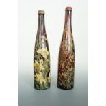 Two late 19th / early 20th Century hand-painted glass wine bottles