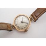 An early 20th Century yellow metal wristlet watch, the movement by Stauffer, Son & Co and branded