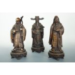 Three bronzed resin Chinese Immortals, tallest 29 cm