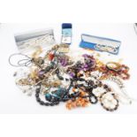 A large quantity of vintage and contemporary costume necklaces and bracelets