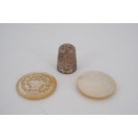 A patent thimble together with a small early 19th Century engraved mother of pearl container