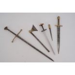 A group of hand-wrought miniature replica weapons including a Scottish dirk, battle axe, Landsknecht