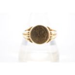 An early 20th Century 18 ct gold signet ring, the circular face bearing an engraved monogram and set