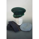 Post-War RAF and Army Air Corps berets together with two German caps