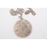 A Thaler coin pendant and neck chain